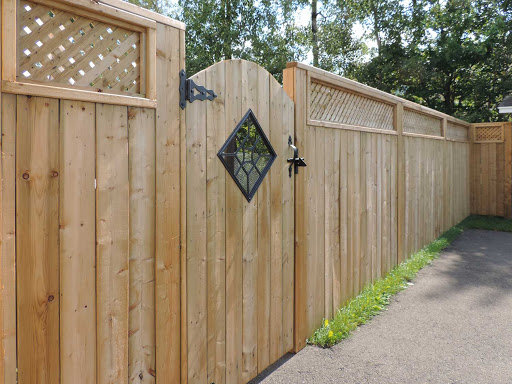 Photo of wooden fence with a gate