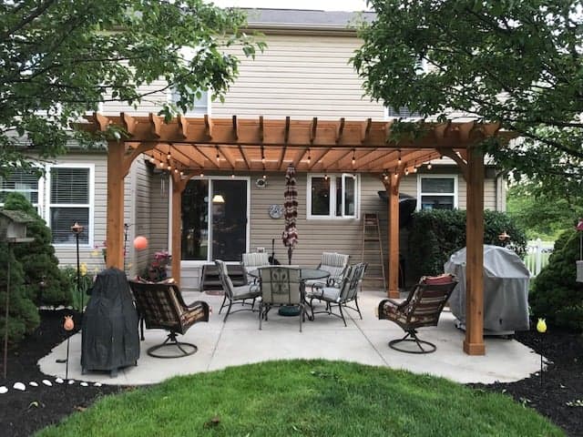 Wooden pergola connected to a house